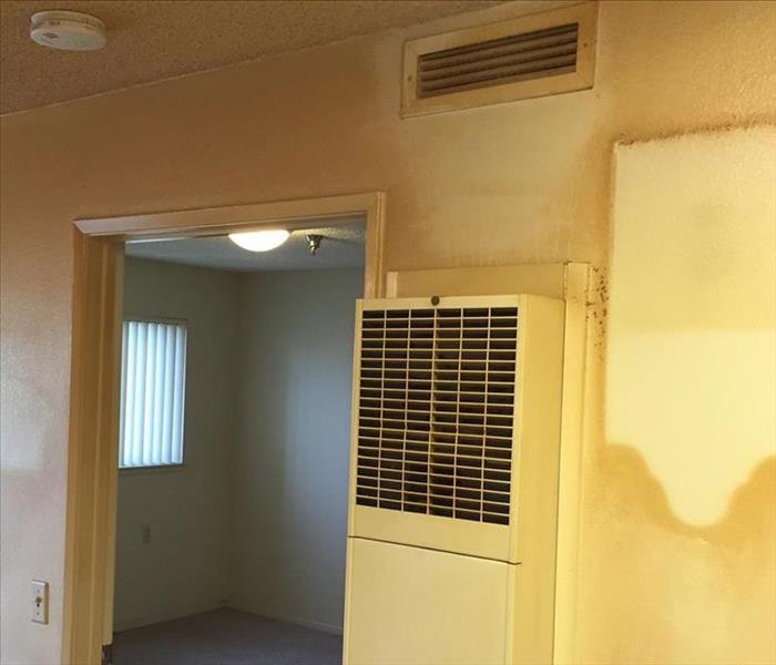 A picture of a room with smoke damage.